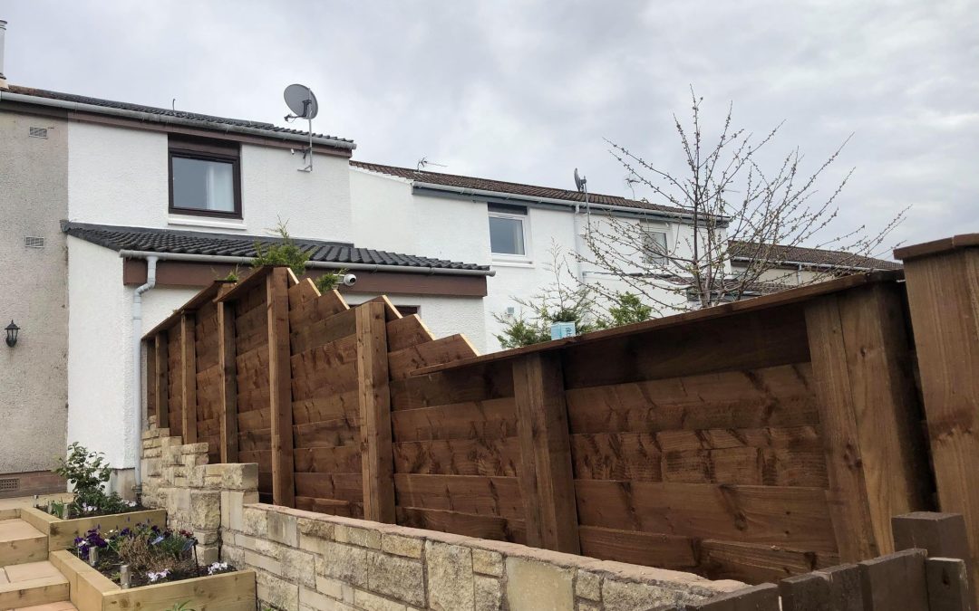 Tall wooden solid fence.