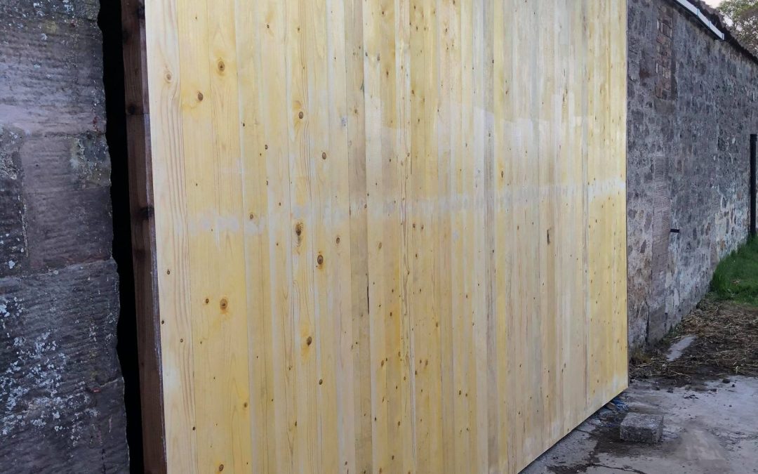 Entrance gate to a large shed